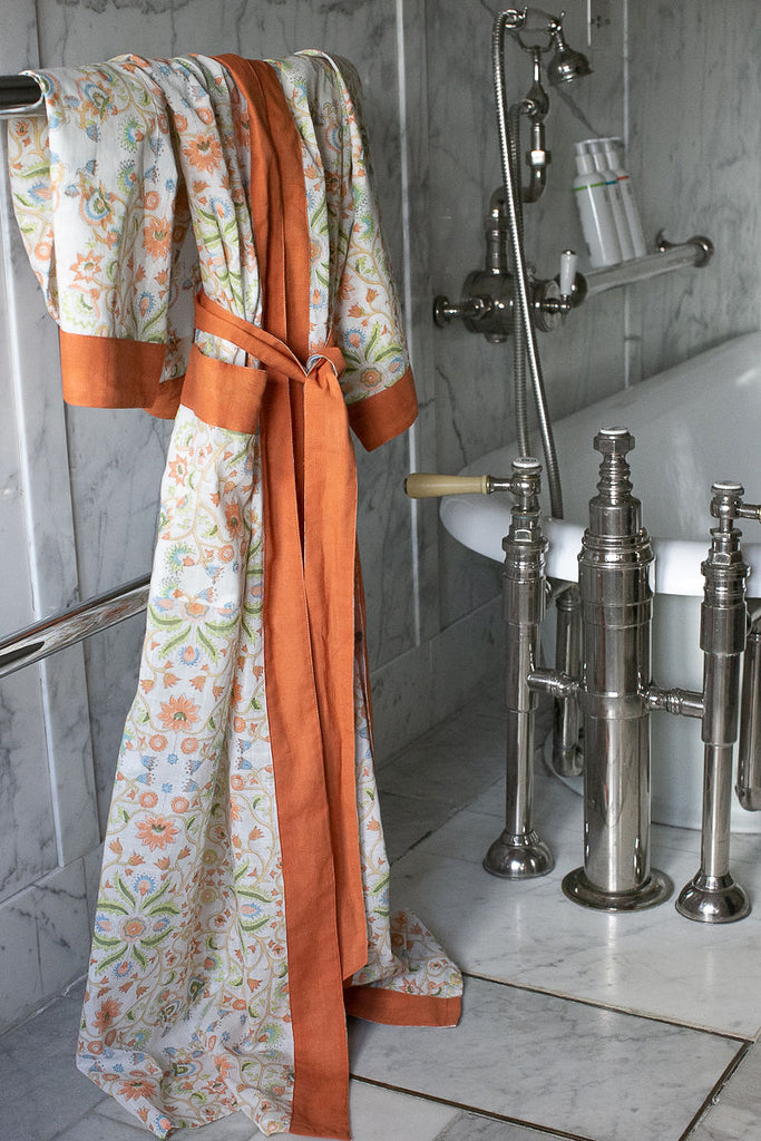 organic cotton kimono draped on a towel rail 