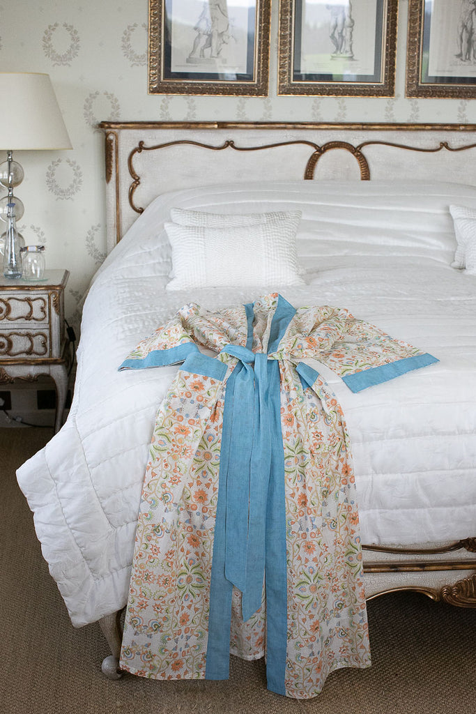 sky blue cotton kimono robe draped on a bed