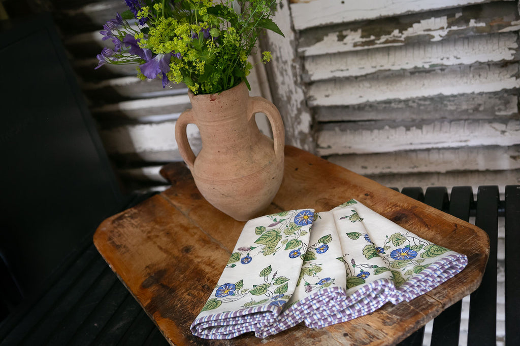 set of 4 napkins on a wooden board