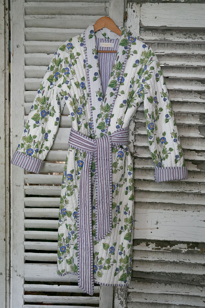 Blockprinted dressing gown in a Morning Glory design hanging on some old shutters