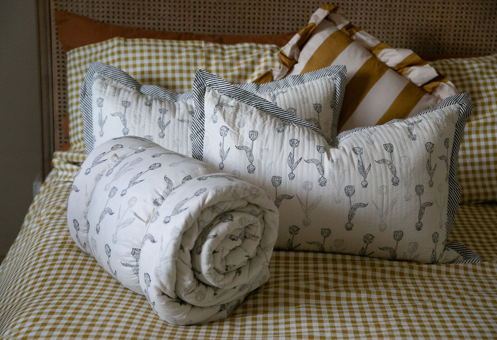 Two hand block printed cushions and a quilt,Tulip design