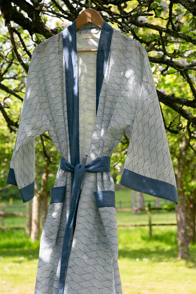 blue block printed kimono robe handing in the garden 