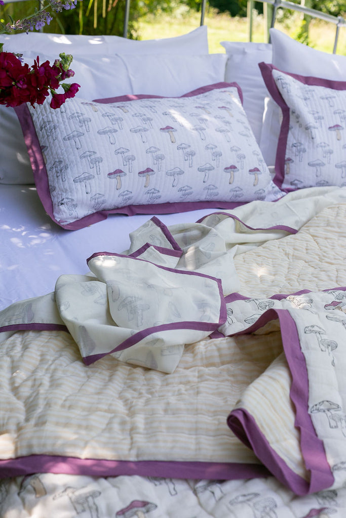 bedding set of block printed bedlinen in a purple mushroom design