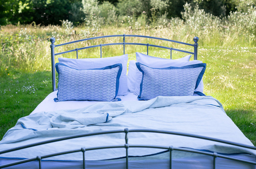 dohar on a metal framed bed in the garden