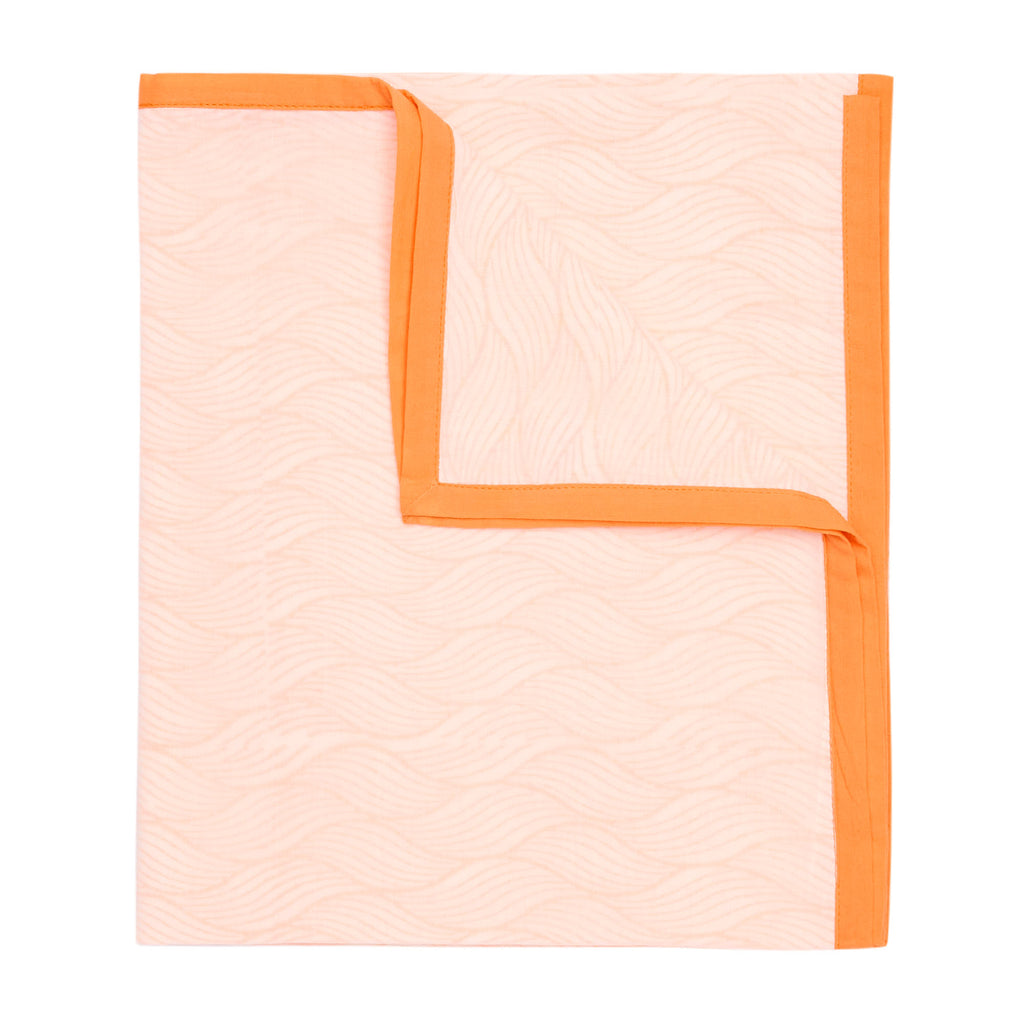 product photo of a folded block printed orange baby sleep dohar