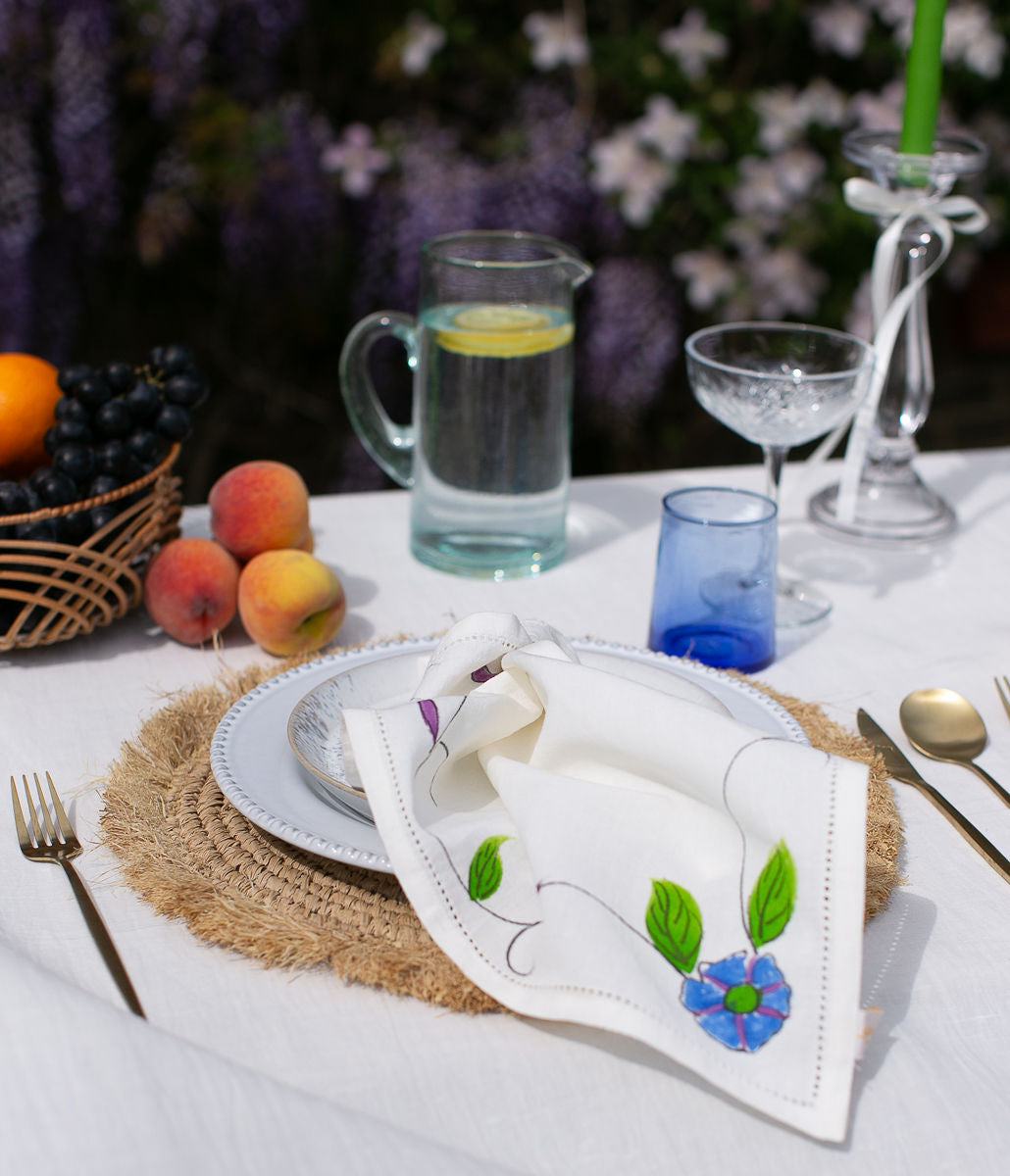 a hand painted napkin on a plate 