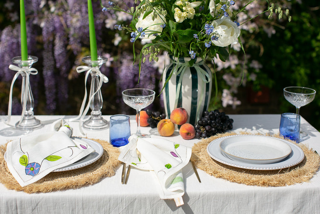 hand painted blue vine cotton linen napkins on a table