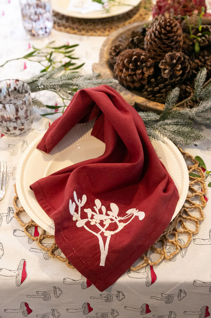 burgundy napkin on a plate 